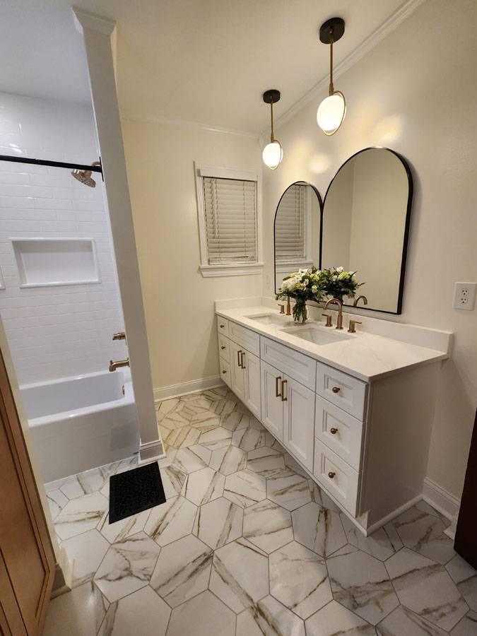 White floating vanity with hexagon marble floor